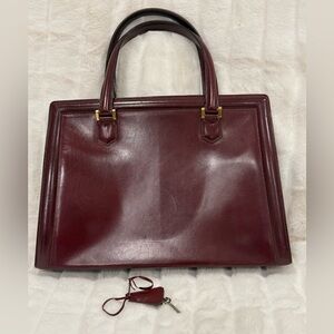 Vintage Leather Burgundy Hermès Pullman handbag with Hermes scarf.
